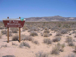 Desert sign mountains blue sky - free forest wallpaper