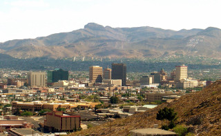 City mountains bird flying foreground - the background and a bird free wallpaper