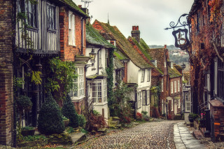 Cobblestone street clock tower medieval - the side of it free wallpaper