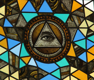 Stained glass window triangle eye - a triangle free wallpaper