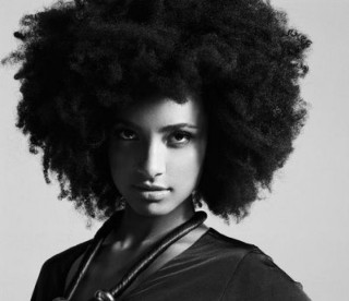 Woman afro posing camera necklace - afrofuturism free wallpaper