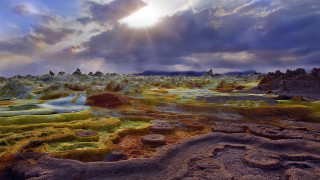 Landscape rocks grass cloudy sky - a landscape free wallpaper