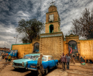 Cars parked building clock tower - afewerk tekle free wallpaper