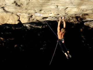 Man climbing mountain rope harness - his waist free wallpaper