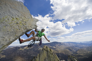 Man climbing mountain helmet rope - extreme illustration free wallpaper