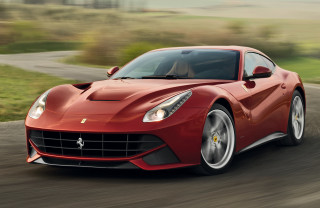 Red sports car green field 2 - a lush green field free wallpaper