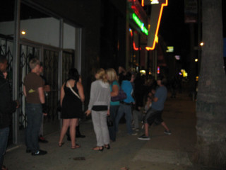 People sidewalk building night neon - movie scene free wallpaper