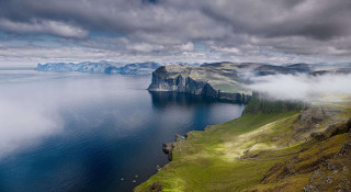Lake mountains clouds boat water 2 - the water below free wallpaper