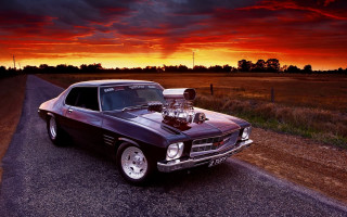 Car sunset redsky mountain ocean - the side of a road free wallpaper