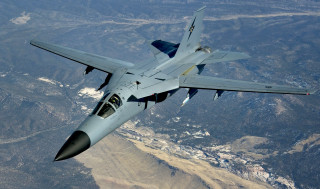 Fighter jet mountain range sky 7 - a valley below free wallpaper