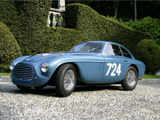 Blue sports car parked hedged - a number free wallpaper