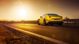 Yellow sports car highway sunset - the horizon behind free wallpaper