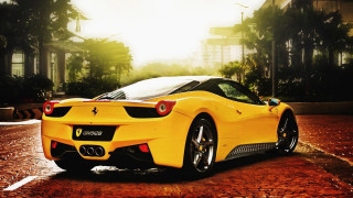 Yellow sports car parking lot 39 - a building in the background free wallpaper