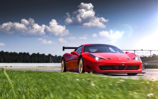 Red sports car road bridge - a cloudy sky in the background free wallpaper