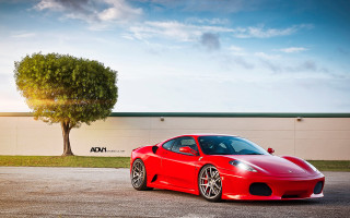 Red sports car parking lot 65 - a tree and a building free wallpaper