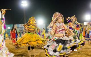 Colorful costumes dancing night field - night time free wallpaper