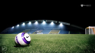 Soccer ball green field night - a lush green field free wallpaper
