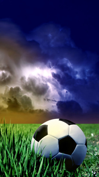 Soccer ball grass cloudy sky 2 - under free wallpaper