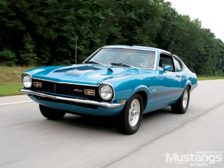 Blue muscle car driving road - tree and grass free wallpaper