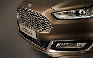 Car closeup headlight black background 2 - a white spot free wallpaper