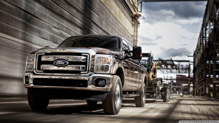 Truck driving street building construction - allen tupper true free wallpaper