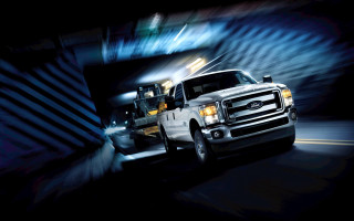 White truck dump truck driving - a street next free wallpaper