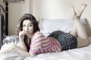 Woman laying bed legs crossed 7 - under her chin free wallpaper