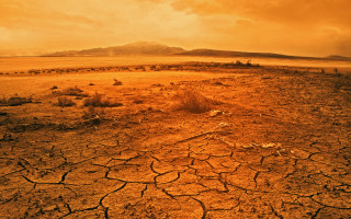 Dry landscape mountain yellow sky - a mountain in the distance free wallpaper