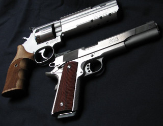 Two guns black background wooden - a wooden barrel free wallpaper
