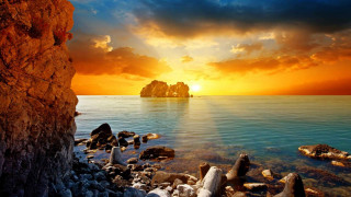 Sunset rocky beach rock formation 2 - a sunset over a rocky beach free wallpaper
