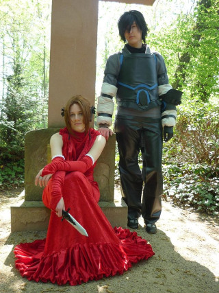 Woman red dress man costume - a sword and a knife free wallpaper