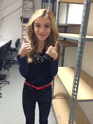 Woman thumbs up shelf blonde - evelyn abelson free wallpaper
