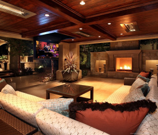 Living room fireplace couch center - warm lighting free wallpaper
