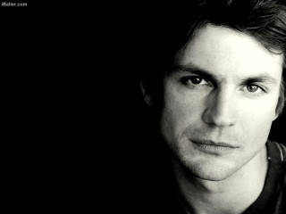 Serious man black white photo - beautiful bone structure free wallpaper