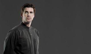 Man black shirt hands pockets - perfect symmetry free wallpaper