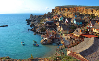 Village cliff ocean boats water - a small village free wallpaper