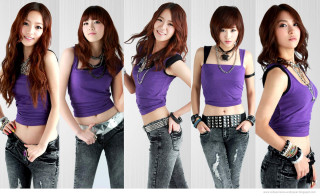 Woman purple top jeans pose - synchromism free wallpaper