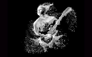 Woman playing guitar water splashing - daniel lieske free wallpaper