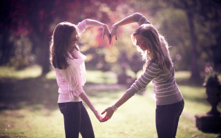 Girls holding hands park trees 3 - free love wallpaper