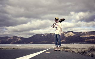 Man skateboard road hat standing - his hand and a hat free wallpaper