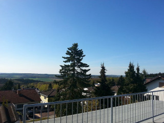 Balcony town view tree blue - ernst free wallpaper