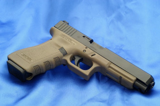 Tan gun blue background black - a stipple free wallpaper