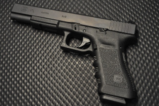 Gun black surface black background - 30mm free wallpaper