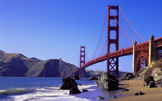 Bridge water mountain beach waves - a large bridge free wallpaper
