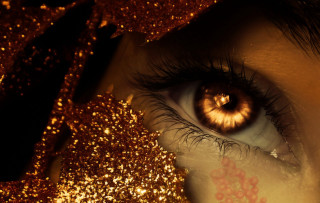 Close up eye gold glitter - a close up of a persons eye free wallpaper
