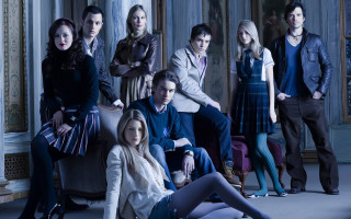 Group people sitting room couch - a group of people sitting free wallpaper