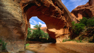 Large rock formation stream cloudy 2 - underneath free wallpaper
