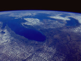 Large crater ocean blue sky - a blue sky background free wallpaper