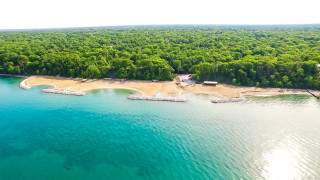 Beach boat dock sandy shore - tree and water free wallpaper