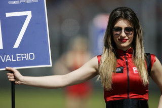 Woman holding sign 17 red - aramenta dianthe vail free wallpaper